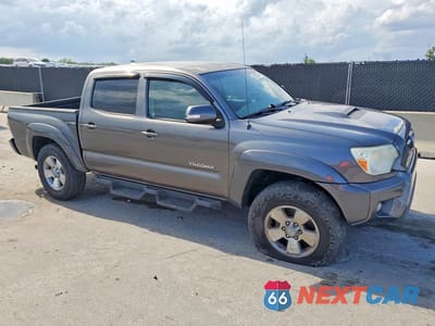 Czwarte zdjęcie samochodu z boku: 2014 TOYOTA TACOMA VIN:5TFJU4GN1EX056691 - miniatura