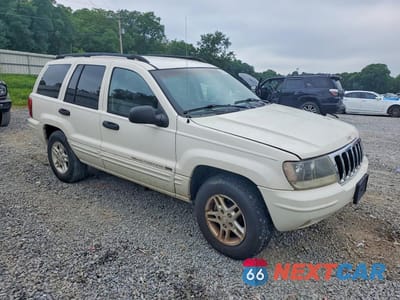 Czwarte zdjęcie samochodu z boku: 2002 JEEP GRAND CHEROKEE LAREDO VIN:1J4GX48S12C313948 - miniatura