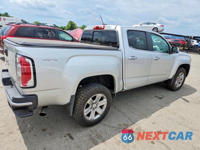 Trzecie zdjęcie samochodu z tyłu: 2016 GMC CANYON SLT VIN:1GTG6DE39G1297894 - miniatura