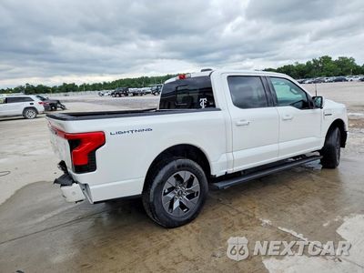 Trzecie zdjęcie samochodu z tyłu: 2023 FORD F150 LIGHTNING PRO VIN:1FT6W1EV8PWG48146 - miniatura