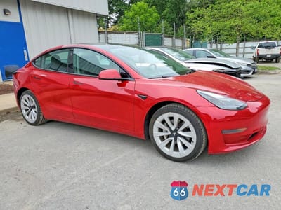 Czwarte zdjęcie samochodu z boku: 2022 TESLA MODEL 3 VIN:5YJ3E1EA7NF369470 - miniatura