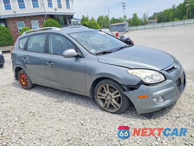 Czwarte zdjęcie samochodu z boku: 2011 HYUNDAI ELANTRA TOURING SE VIN:KMHDC8AEXBU090511 - miniatura