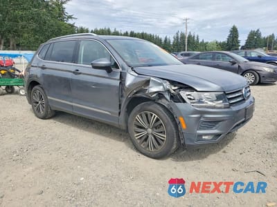 Czwarte zdjęcie samochodu z boku: 2018 VOLKSWAGEN TIGUAN SE VIN:3VV2B7AX9JM076999 - miniatura