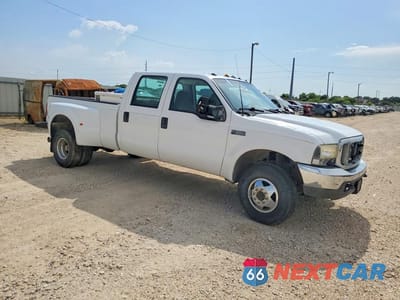 Czwarte zdjęcie samochodu z boku: 1999 FORD F350 SUPER DUTY VIN:1FTWW33F0XEC15031 - miniatura