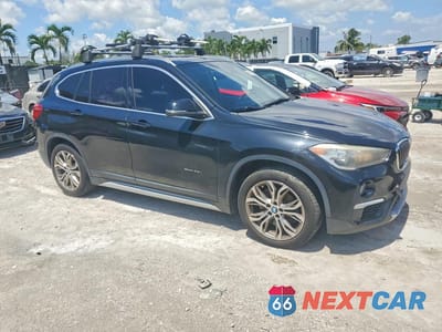Czwarte zdjęcie samochodu z boku: 2017 BMW X1 SDRIVE28I VIN:WBXHU7C38H5H37568 - miniatura