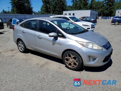 Czwarte zdjęcie samochodu z boku: 2011 FORD FIESTA SEL VIN:3FADP4CJ5BM210270 - miniatura