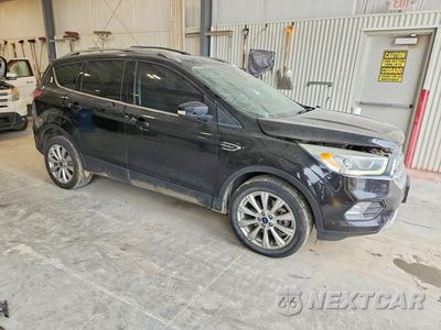 Czwarte zdjęcie samochodu z boku: 2017 FORD ESCAPE TITANIUM VIN:1FMCU9JD6HUA84509 - miniatura