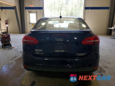 Zdjęcie 6 z 12 samochodu: 2016 FORD FOCUS TITANIUM VIN:1FADP3J26GL335759 - miniatura