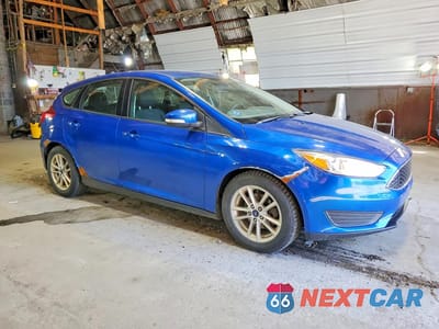 Czwarte zdjęcie samochodu z boku: 2018 FORD FOCUS SE VIN:1FADP3K21JL298061 - miniatura
