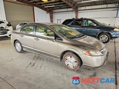 Czwarte zdjęcie samochodu z boku: 2006 HONDA CIVIC HYBRID VIN:JHMFA36206S028801 - miniatura