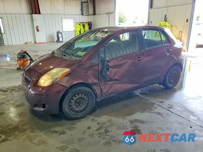 2009 TOYOTA YARIS BASE JTDKT903595252034 - główne zdjęcie licytacji z USA - miniatura