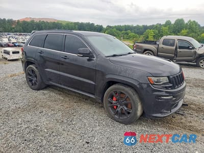 Czwarte zdjęcie samochodu z boku: 2014 JEEP GRAND CHEROKEE SRT-8 VIN:1C4RJFDJ0EC169581 - miniatura