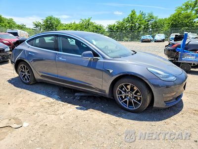 Czwarte zdjęcie samochodu z boku: 2019 TESLA MODEL 3 VIN:5YJ3E1EB2KF386150 - miniatura