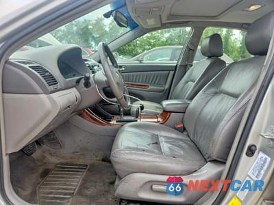 Zdjęcie 7 z 12 samochodu: 2003 TOYOTA CAMRY XLE VIN:4T1BE30K13U665365 - miniatura