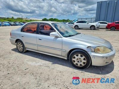 Czwarte zdjęcie samochodu z boku: 1999 HONDA CIVIC LX VIN:1HGEJ6670XL015490 - miniatura