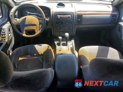 Zdjęcie 8 z 13 samochodu: 1999 JEEP GRAND CHEROKEE LAREDO VIN:1J4GW58S1XC501613 - miniatura