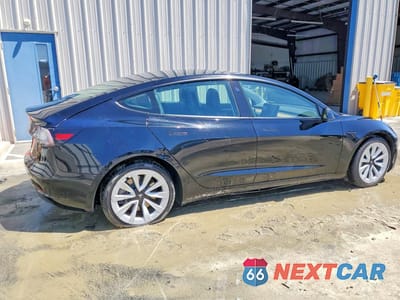 Trzecie zdjęcie samochodu z tyłu: 2022 TESLA MODEL 3 VIN:5YJ3E1EAXNF188623 - miniatura