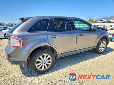 Trzecie zdjęcie samochodu z tyłu: 2010 FORD EDGE SEL VIN:2FMDK4JC9ABB69506 - miniatura
