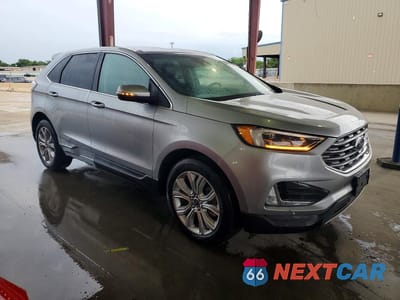 Czwarte zdjęcie samochodu z boku: 2022 FORD EDGE TITANIUM- R&D- CLN TITLE- PRI FLEET VIN:2FMPK4K9XNBB04458 - miniatura