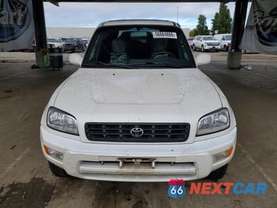 Piąte zdjęcie samochodu w środku: 1999 TOYOTA RAV4 BASE VIN:JT3HP10V7X7135353 - miniatura