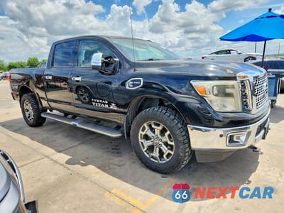 Czwarte zdjęcie samochodu z boku: 2017 NISSAN TITAN XD SL VIN:1N6BA1F46HN572465 - miniatura
