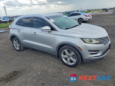 Czwarte zdjęcie samochodu z boku: 2015 LINCOLN MKC VIN:5LMCJ1A96FUJ18223 - miniatura