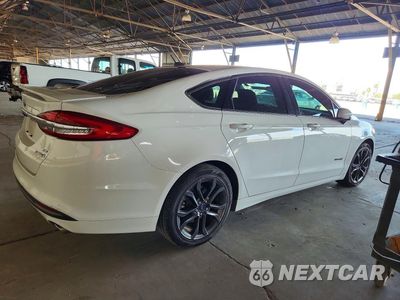 Trzecie zdjęcie samochodu z tyłu: 2018 FORD FUSION SE HYBRID VIN:3FA6P0LUXJR101591 - miniatura