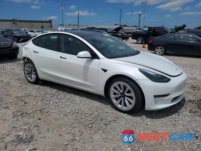 Czwarte zdjęcie samochodu z boku: 2023 TESLA MODEL 3 VIN:5YJ3E1EA0PF671640 - miniatura