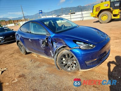 Czwarte zdjęcie samochodu z boku: 2022 TESLA MODEL Y VIN:7SAYGDEE3NA011075 - miniatura
