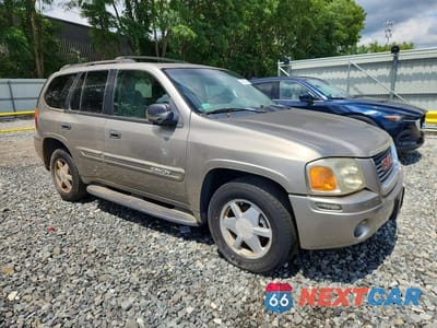 Czwarte zdjęcie samochodu z boku: 2002 GMC ENVOY VIN:1GKDT13S322106076 - miniatura