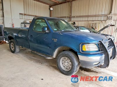 Czwarte zdjęcie samochodu z boku: 2001 FORD F150 VIN:1FTRF18L91NB60604 - miniatura