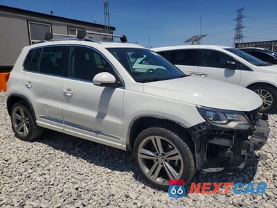 Czwarte zdjęcie samochodu z boku: 2014 VOLKSWAGEN TIGUAN S VIN:WVGAV3AX3EW009701 - miniatura