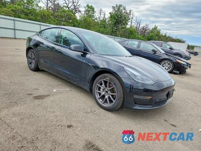Czwarte zdjęcie samochodu z boku: 2023 TESLA MODEL 3 VIN:5YJ3E1EA4PF704400 - miniatura