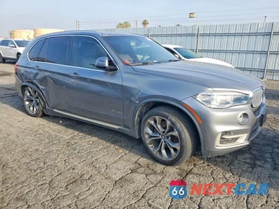 Czwarte zdjęcie samochodu z boku: 2018 BMW X5 XDR40E VIN:5UXKT0C52J0W04088 - miniatura