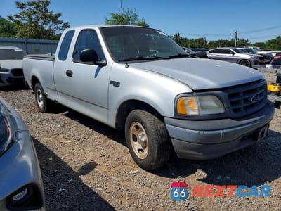 Czwarte zdjęcie samochodu z boku: 2002 FORD F-150 VIN:1FTRX17242NB29395 - miniatura