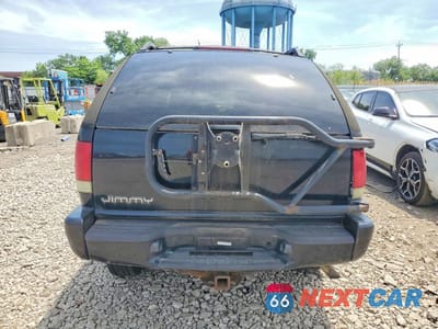 Zdjęcie 6 z 12 samochodu: 2001 GMC JIMMY VIN:1GKCT18W31K254864 - miniatura