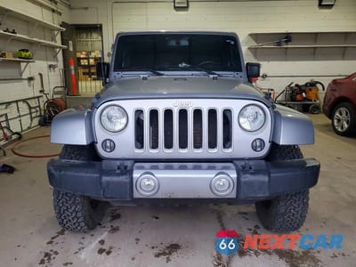 Piąte zdjęcie samochodu w środku: 2016 JEEP WRANGLER UNLIMITED SAHARA VIN:1C4BJWEG0GL253326 - miniatura