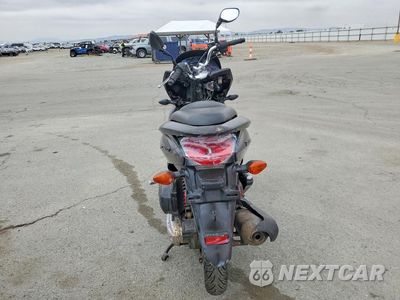 Czwarte zdjęcie samochodu z boku: 2013 HONDA PCX 150 VIN:MLHKF121XD5001388 - miniatura