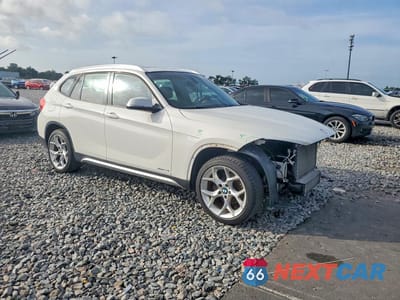 Czwarte zdjęcie samochodu z boku: 2014 BMW X1 SDRIVE28I VIN:WBAVM1C54EVW53302 - miniatura