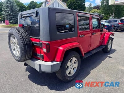 Czwarte zdjęcie samochodu z boku: 2010 JEEP WRANGLER UNLIMITED SAHARA VIN:1J4BA5H16AL215165 - miniatura