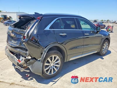 Trzecie zdjęcie samochodu z tyłu: 2022 CADILLAC XT4 PREMIUM LUXURY VIN:1GYFZDR49NF100125 - miniatura