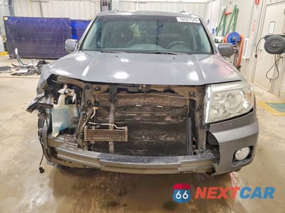 Piąte zdjęcie samochodu w środku: 2011 HONDA PILOT TOURING VIN:5FNYF4H9XBB075482 - miniatura