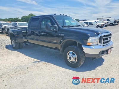 Czwarte zdjęcie samochodu z boku: 2002 FORD F350 SUPER DUTY VIN:1FTWW33F82EB43469 - miniatura
