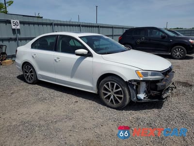 Czwarte zdjęcie samochodu z boku: 2016 VOLKSWAGEN JETTA COMFORTLINE VIN:3VWD07AJ7GM388642 - miniatura