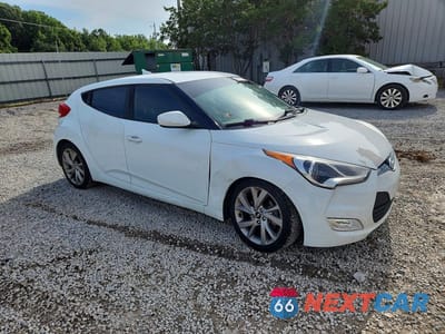 Czwarte zdjęcie samochodu z boku: 2017 HYUNDAI VELOSTER BASE VIN:KMHTC6AD2HU312541 - miniatura