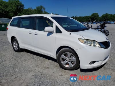 Czwarte zdjęcie samochodu z boku: 2014 TOYOTA SIENNA L 7-PASSENGER VIN:5TDZK3DC3ES450849 - miniatura