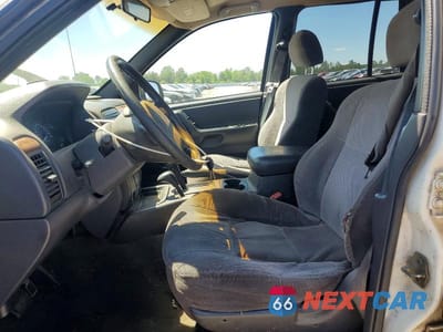 Zdjęcie 7 z 13 samochodu: 1999 JEEP GRAND CHEROKEE LAREDO VIN:1J4GW58S1XC501613 - miniatura