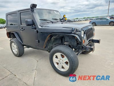Czwarte zdjęcie samochodu z boku: 2010 JEEP WRANGLER SPORT VIN:1J4AA2D14AL216900 - miniatura