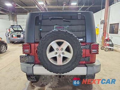 Zdjęcie 6 z 13 samochodu: 2009 JEEP WRANGLER UNLIMITED SAHARA VIN:1J4GA591X9L759460 - miniatura