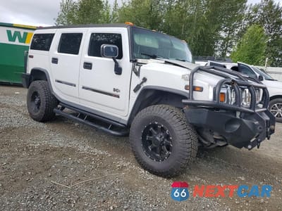 Czwarte zdjęcie samochodu z boku: 2004 HUMMER H2 VIN:5GRGN23U74H100340 - miniatura